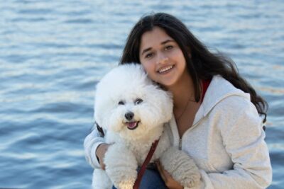 Woman With Her Bichon Frise